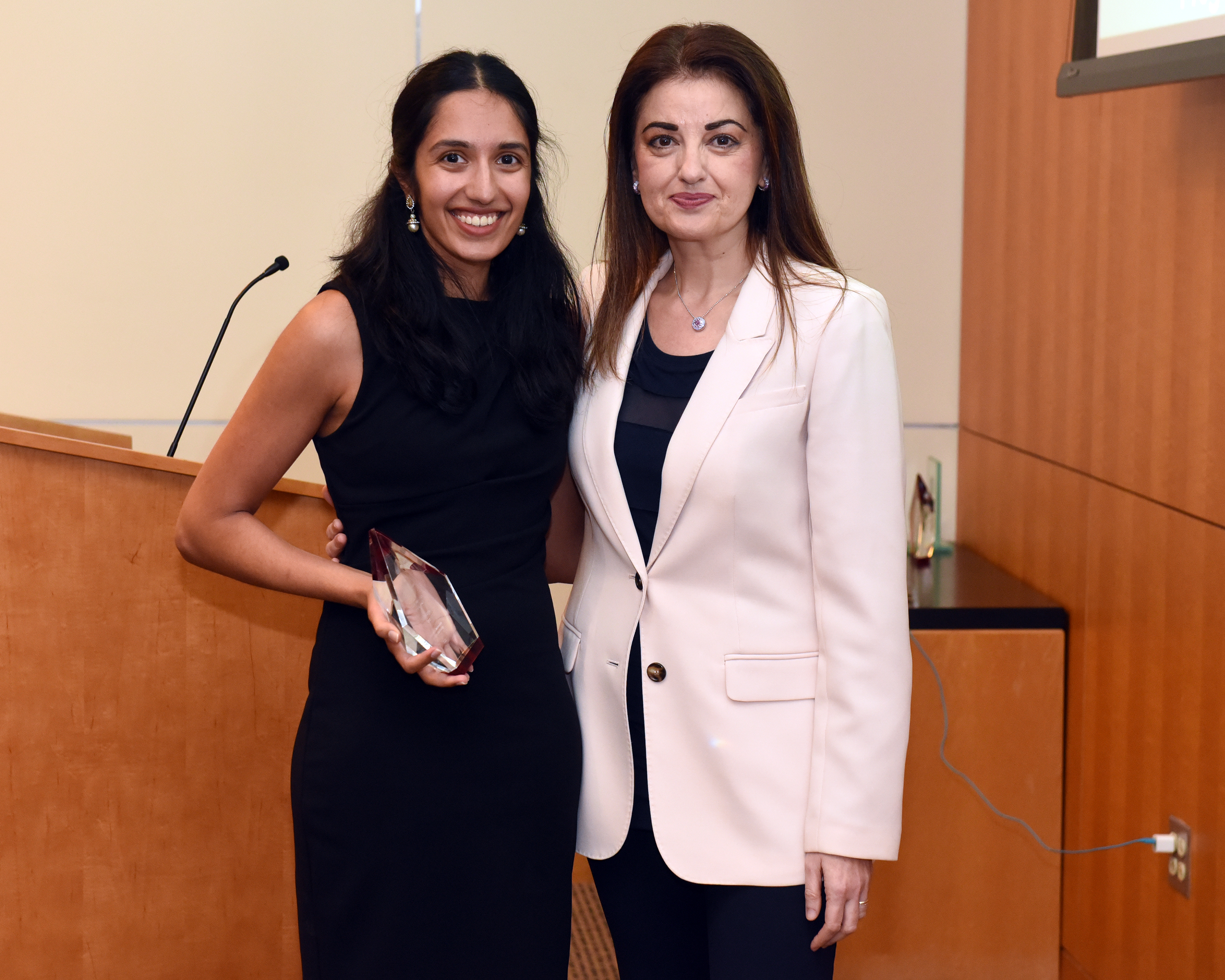 Aishwarya Iyer and  Dr. Kontrogianni-Konstantopoulos stand next to each other. Aishwarya is holding her Otani Award