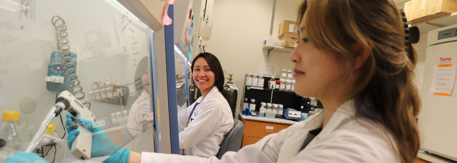 Two female students in a lab
