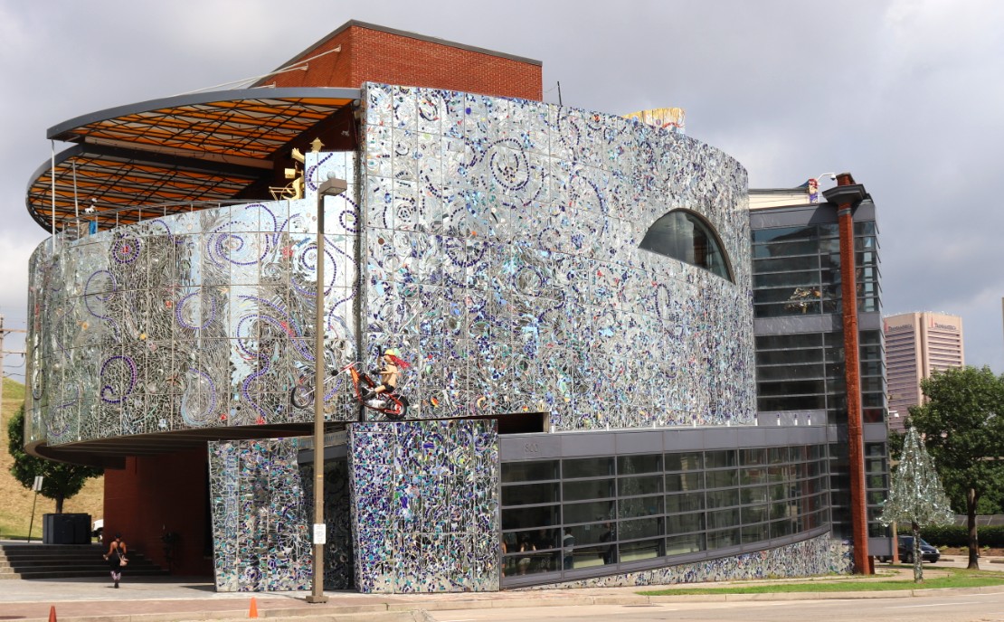 The American Visionary Art Museum, a round building with a mirrored mosaic facade